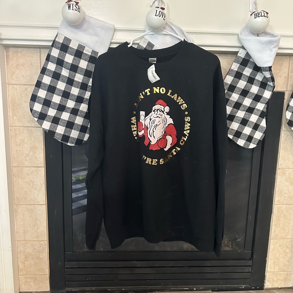 Ain’t no laws when your Santa claws sweatshirt